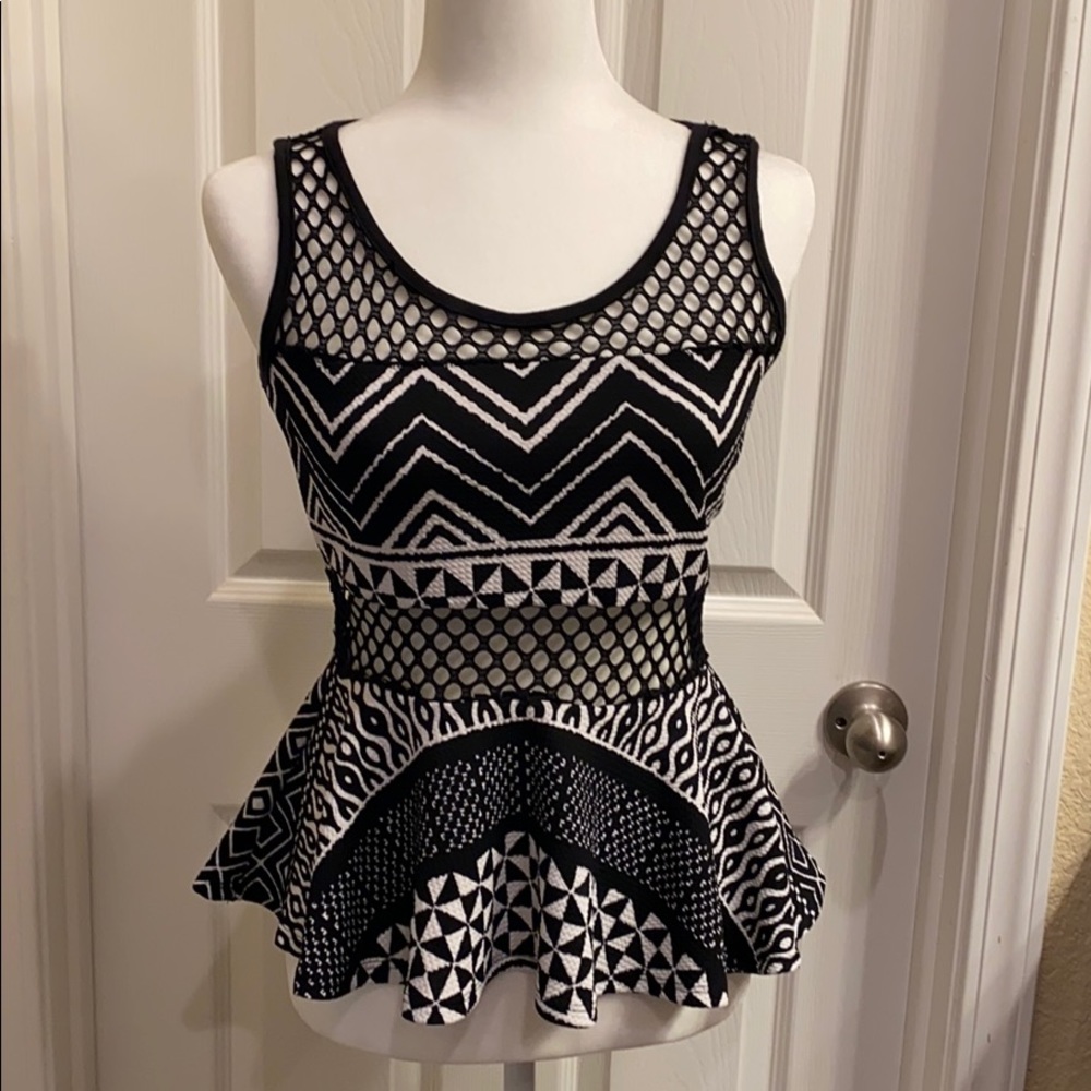 BLACK AND WHITE LACE CUTOUT PEPLUM TOP